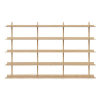 Light wooden shelving unit with a minimalist design, featuring multiple horizontal shelves arranged in a repeating pattern.