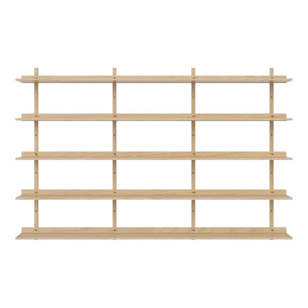 Light wooden shelving unit with a minimalist design, featuring multiple horizontal shelves arranged in a repeating pattern.