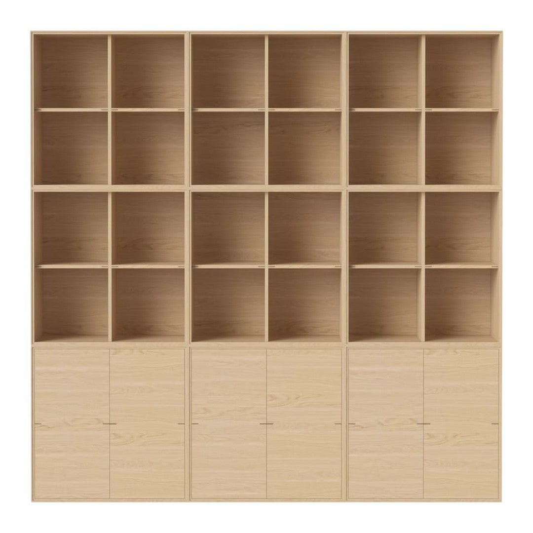 Light wood bookshelf with 16 open compartments and 4 closed cabinets, featuring a smooth, natural wood grain pattern.