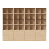 Light wood shelving unit with 20 square compartments and 6 cabinet doors in a natural finish. Perfect for organized storage.