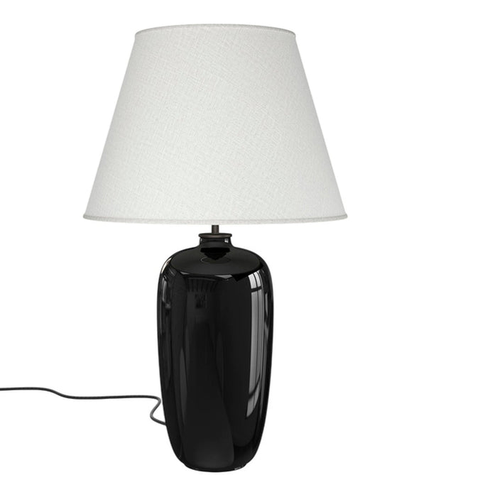 Black ceramic lamp base with a textured white fabric shade, perfect for modern decor.