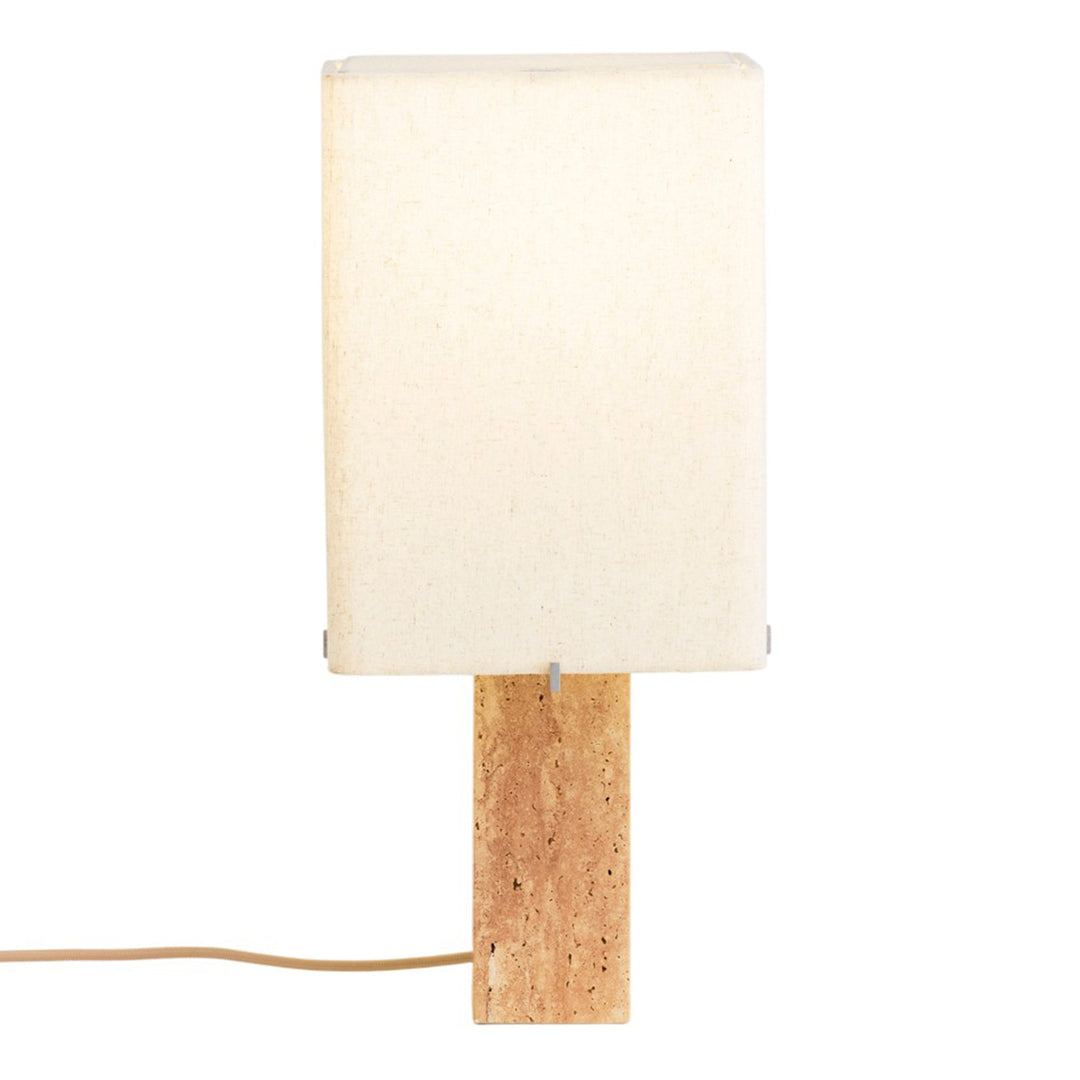 White rectangular lamp shade on a natural wood base with a beige cord, minimalistic design and neutral colors.