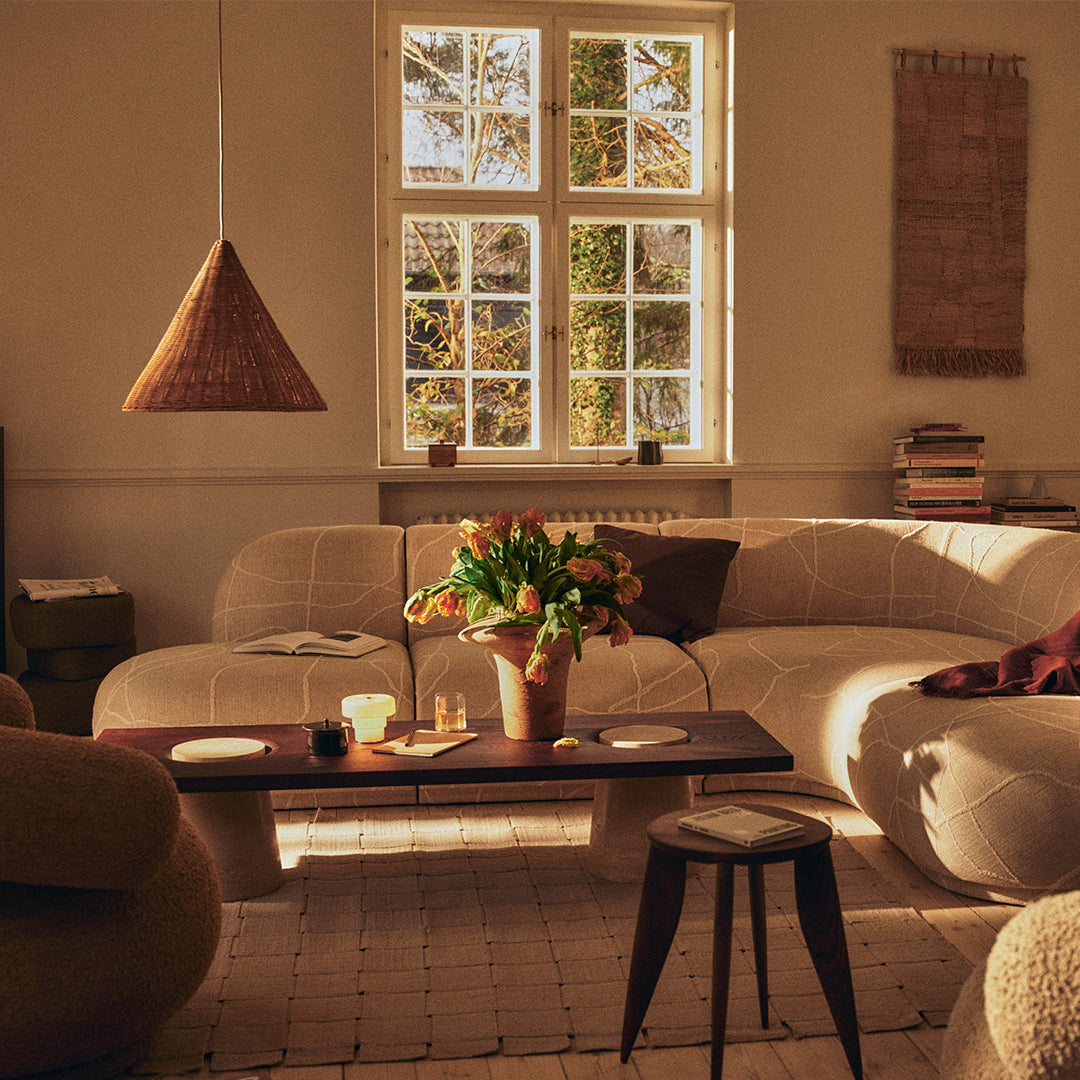 Warm beige tones with soft textures and natural patterns, featuring a cozy, inviting living space.
