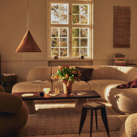 Warm beige tones with soft textures and natural patterns, featuring a cozy, inviting living space.