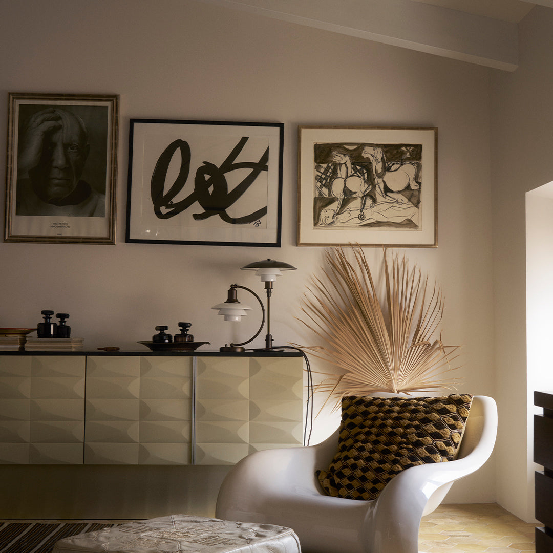 Contemporary living room featuring geometric patterns in neutral tones, black and white art, with stylish textures.