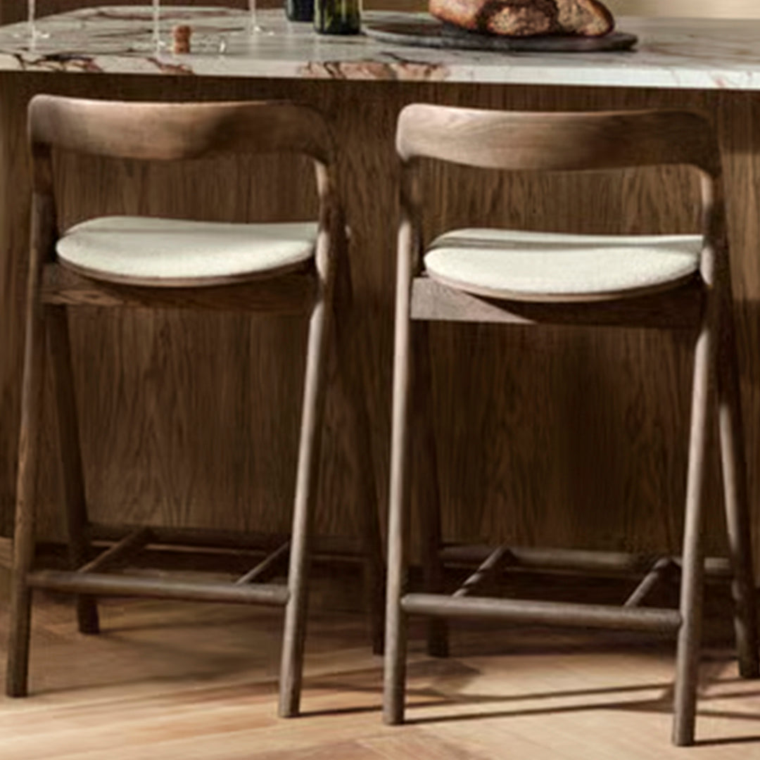 "Stylish walnut bar stools with light beige cushioned seats, perfect for modern home decor."