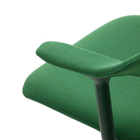 Green textured fabric armchair with a rich, vibrant hue and subtle geometric patterns. Perfect for modern decor.