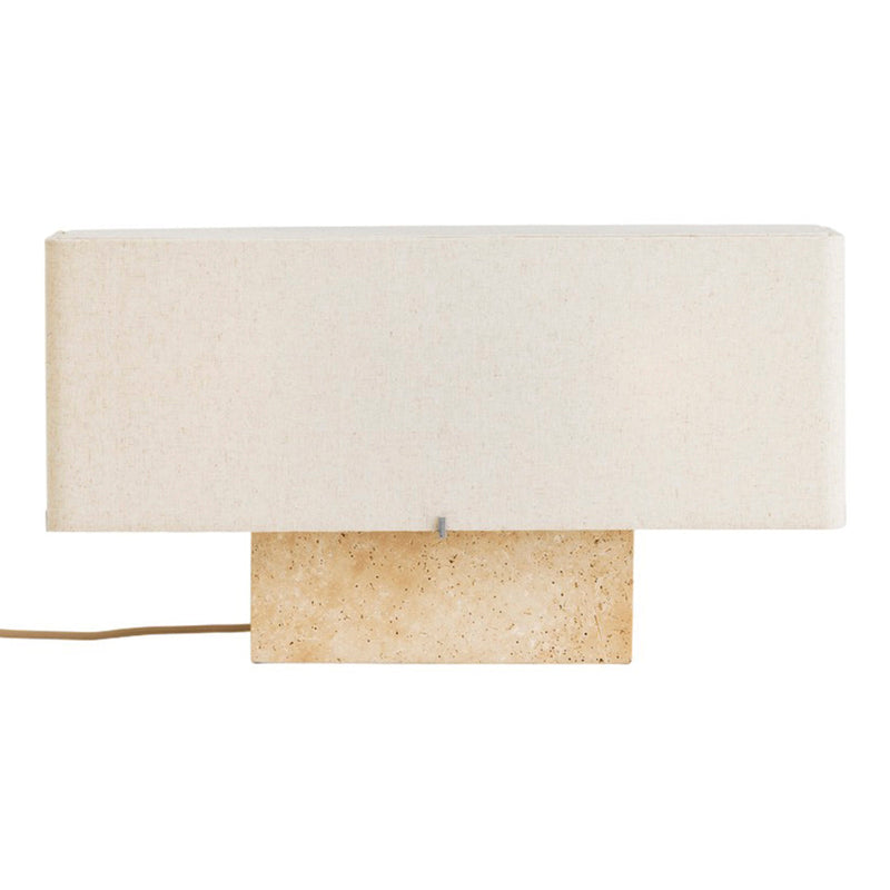 Minimalist beige lamp with a textured stone base and a soft white fabric shade, perfect for modern decor.