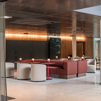 Contemporary lounge set with beige and rust-colored upholstery, featuring sleek, minimalist design accents.