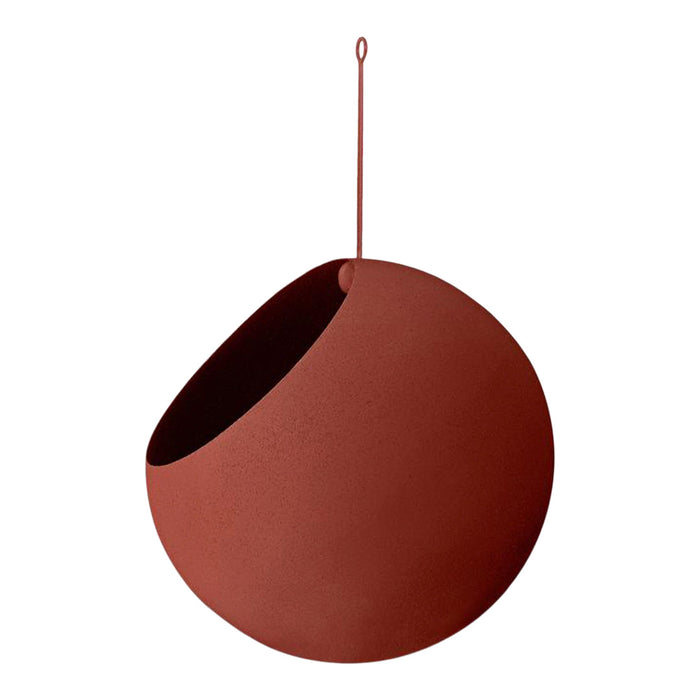 Round terracotta hanging planter with a smooth matte finish and contrasting dark interior. Modern earthy tones.