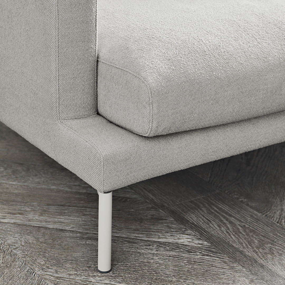 Light gray textured upholstery with a smooth finish, complemented by sleek white legs. Modern minimalist design.
