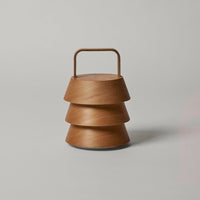 Brown layered design lantern with a smooth finish and minimalistic handle, perfect for modern decor.