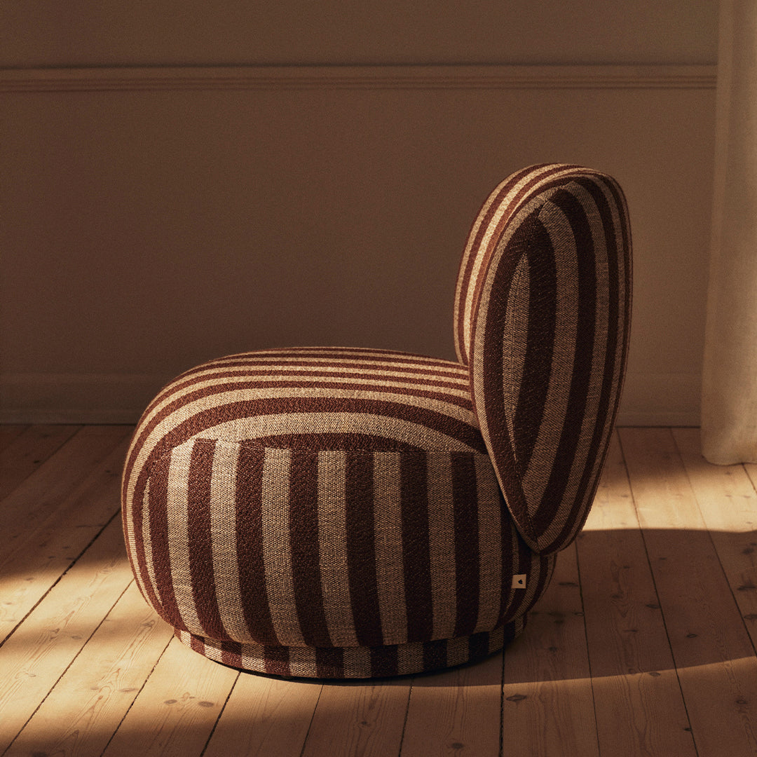 Brown and beige striped upholstered chair with a rounded shape and playful design. Perfect for modern decor.