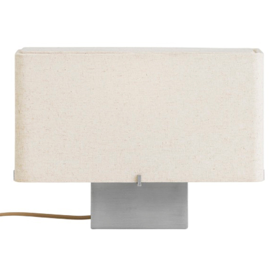Beige fabric lamp shade with a sleek metallic base, featuring a minimalist design and neutral tones.