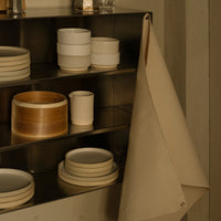 Neutral-toned kitchenware with creamy whites and soft beige, showcasing minimalist elegance and natural textures.