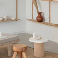 Modern interior featuring neutral tones, earthy browns, and natural textures in a minimalist setting.