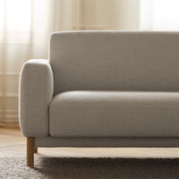 Light gray sofa with a textured fabric and simple, modern design, complemented by a natural wood frame.