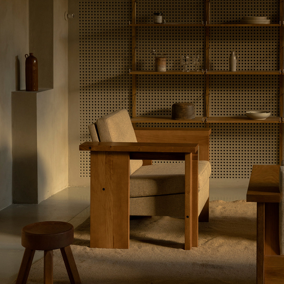 Natural wood tones with a warm beige fabric, featuring a minimalist design and soft textures in a cozy setting.