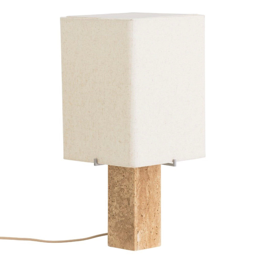 White fabric lamp shade with a textured beige stone base, featuring a minimalist design and neutral color palette.