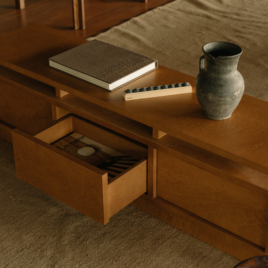 Elegant wooden side table with warm honey tones, featuring a minimalist design, textured patterns, and earthy accents.