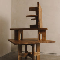 Geometric wooden furniture with a warm, natural finish and contrasting light and dark patterns.