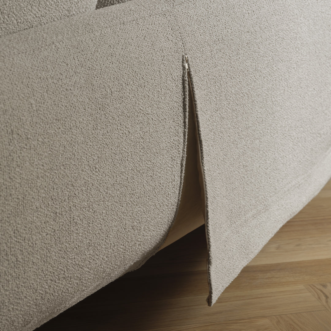 Beige textured fabric with a subtle split detail, perfect for modern home decor.