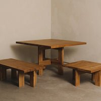 Wooden table and benches featuring a natural finish, showcasing rich brown tones and simple geometric patterns.