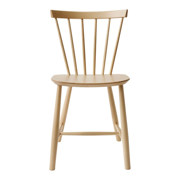 Light natural wood chair with a minimalist design featuring smooth, warm tones and simple spindle back.