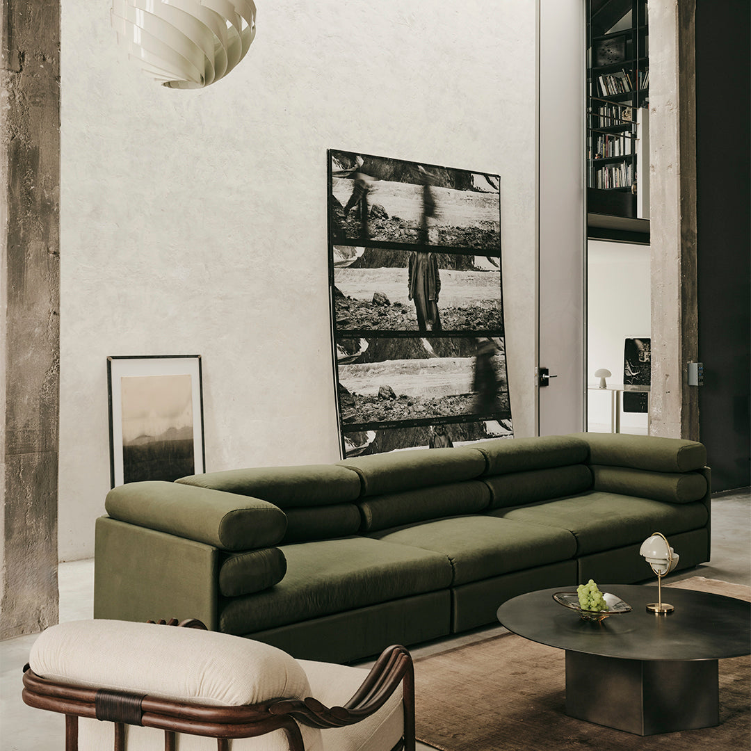 Sleek olive green sectional sofa with a modern pattern, set against a minimalist backdrop for a stylish look.