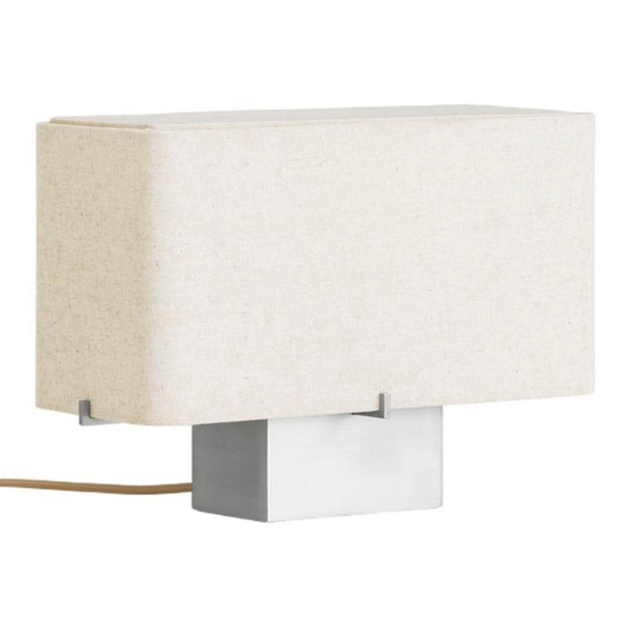 Beige rectangular lampshade on a silver base, featuring a minimalist design. Soft, neutral colors for versatile decor.