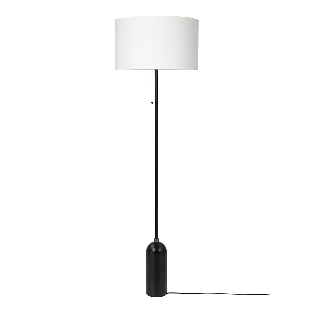 Black floor lamp with a sleek design and a white cylindrical shade for a modern touch. Ideal for stylish interiors.