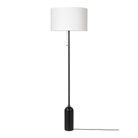 Black floor lamp with a sleek design and a white cylindrical shade for a modern touch. Ideal for stylish interiors.