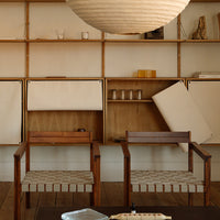 "Neutral tones with textured beige cushions and natural wood accents in a modern interior setting."