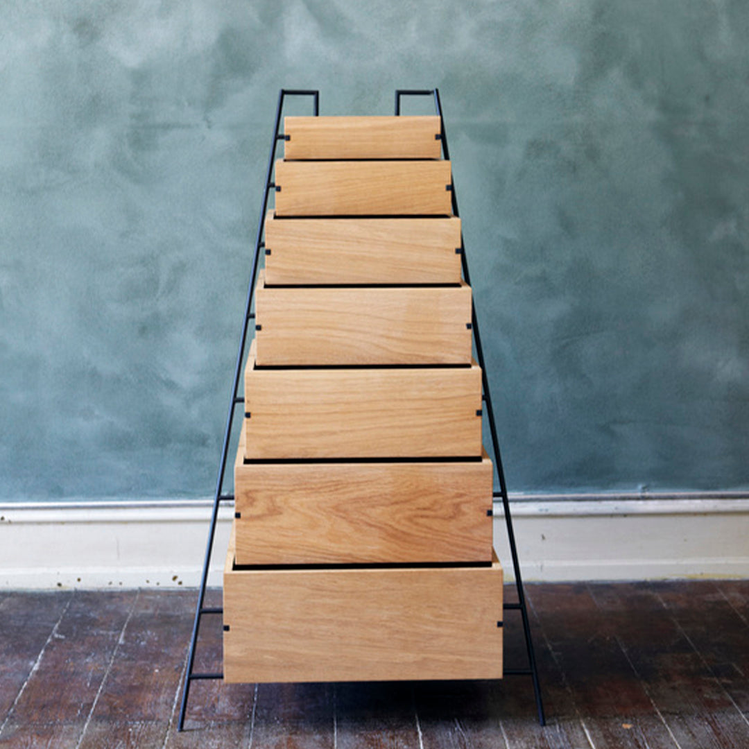 "Modern wooden ladder shelf with natural oak finish and sleek black metal frame."