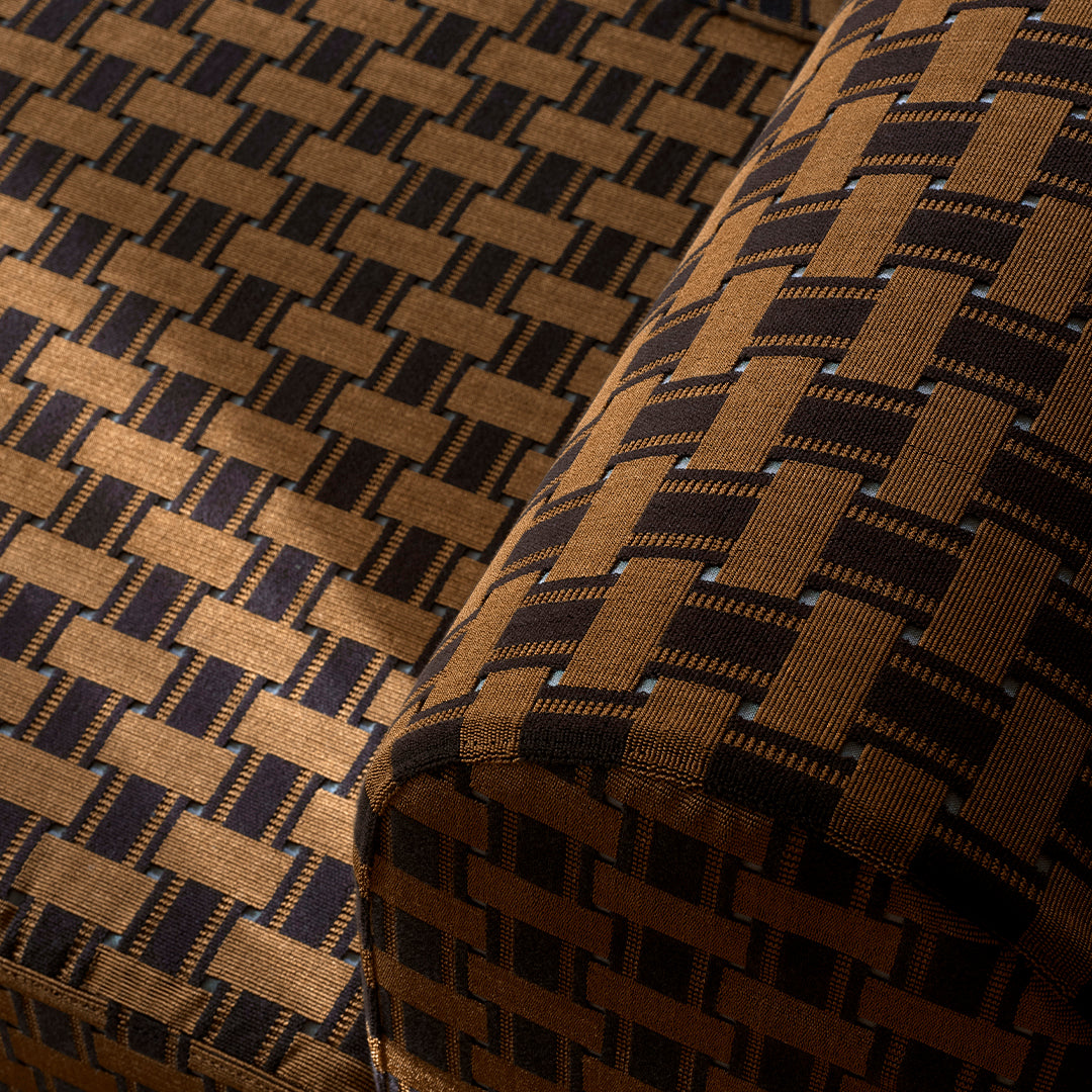 Brown and navy geometric woven pattern fabric showcasing a textured design and alternating block shapes.