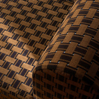 Brown and navy geometric woven pattern fabric showcasing a textured design and alternating block shapes.