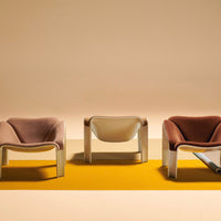 Stylish chairs in lavender, white, and blush, set against a vibrant yellow geometric backdrop. Perfect for modern decor.
