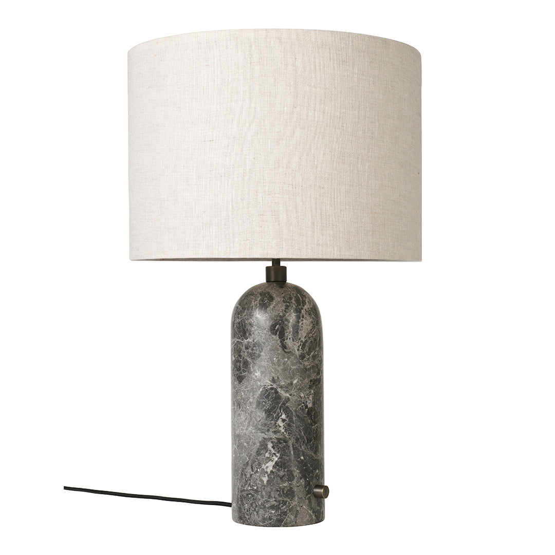 Gray marble lamp base with a beige linen shade, perfect for adding a modern touch to any decor.
