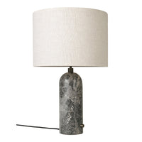 Gray marble lamp base with a beige linen shade, perfect for adding a modern touch to any decor.