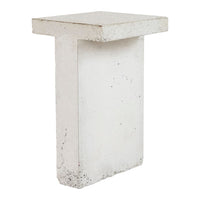 White concrete accent table with a minimalist design and smooth surface. Ideal for modern decor.