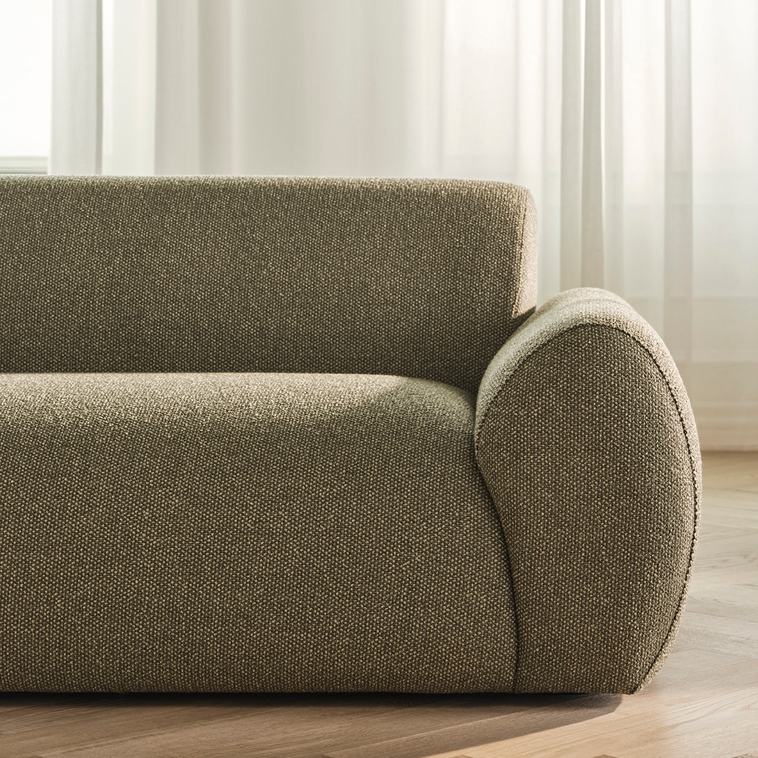 Taupe sofa upholstery with subtle texture and a soft, rounded arm design, perfect for modern interiors.
