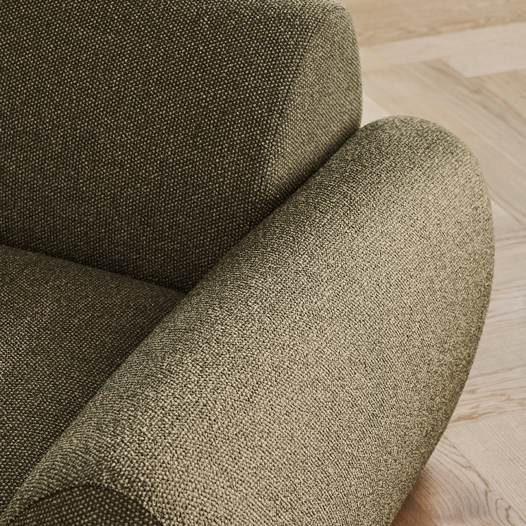 Textured olive green fabric with a subtle pattern, showcasing understated elegance and modern design.