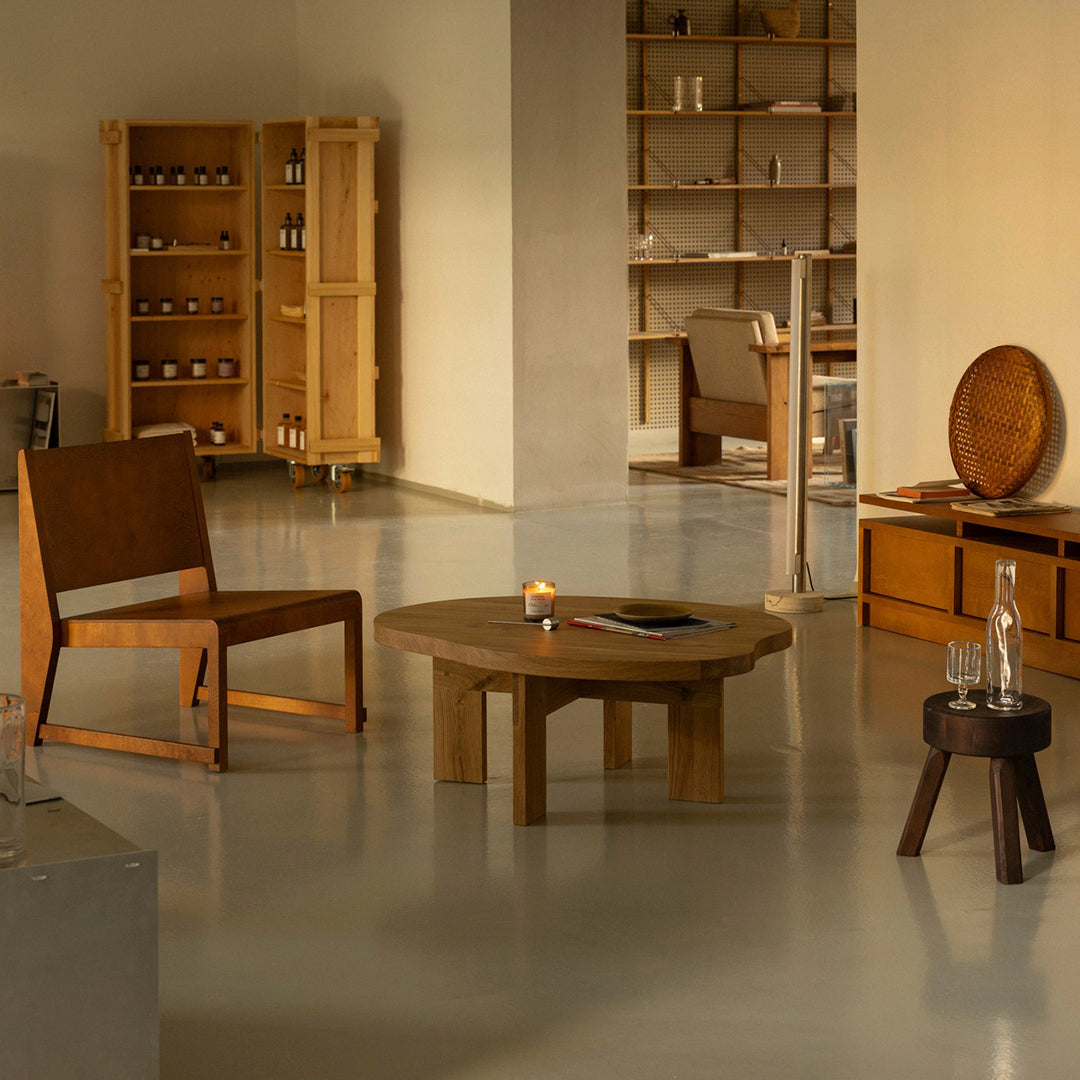 Modern living room featuring wood tones, warm neutrals, and smooth surfaces with minimalist design elements.