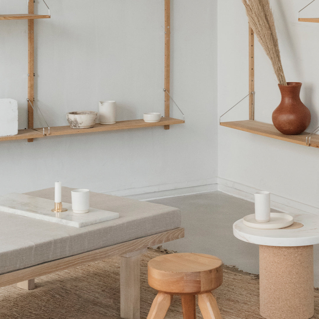 Neutral tones with beige, white, and clay accents; minimalist decor featuring natural textures and simple patterns.