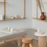 Neutral tones with beige, white, and clay accents; minimalist decor featuring natural textures and simple patterns.