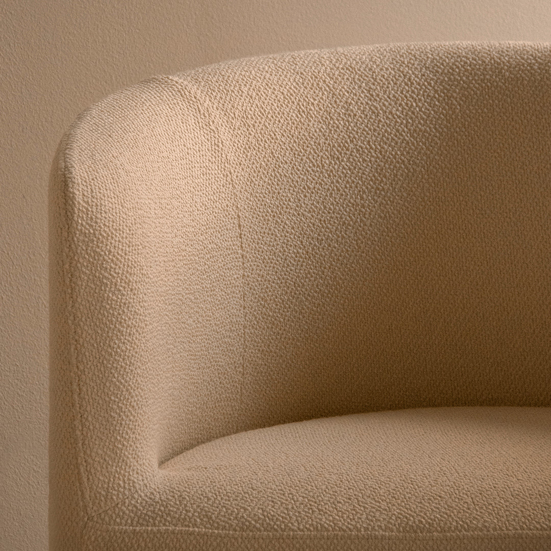 Beige textured upholstery with a subtle woven pattern, adding elegance and warmth to any space.
