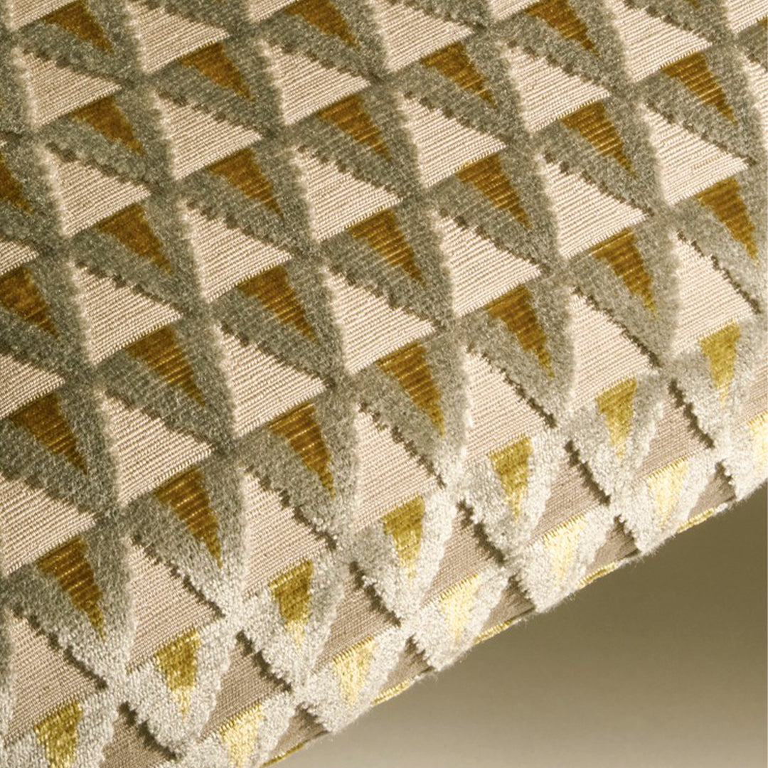 Geometric triangle pattern in cream, gold, and silver hues, creating a stylish and modern textile design.