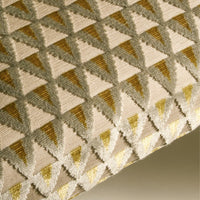 Geometric triangle pattern in cream, gold, and silver hues, creating a stylish and modern textile design.