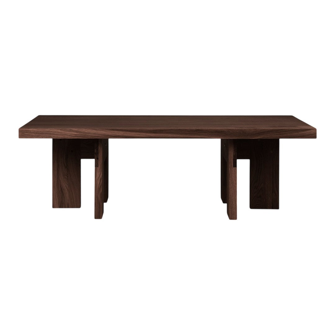 Dark walnut wood coffee table with a minimalist design and angular legs. Perfect for modern decor.