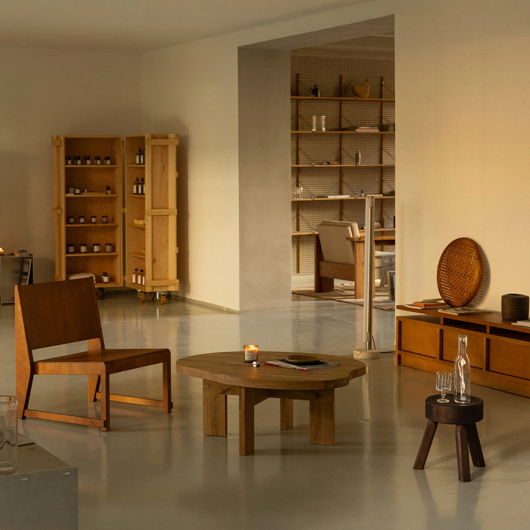 "Modern interior featuring warm wooden tones, sleek lines, and natural textures in a minimalist setting."